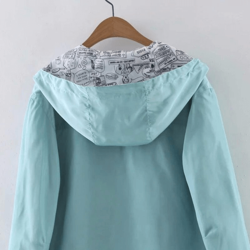 Stylish blue two-sided women's windbreaker with printed hood, ideal for fashion and comfort. Product code: SF1478.